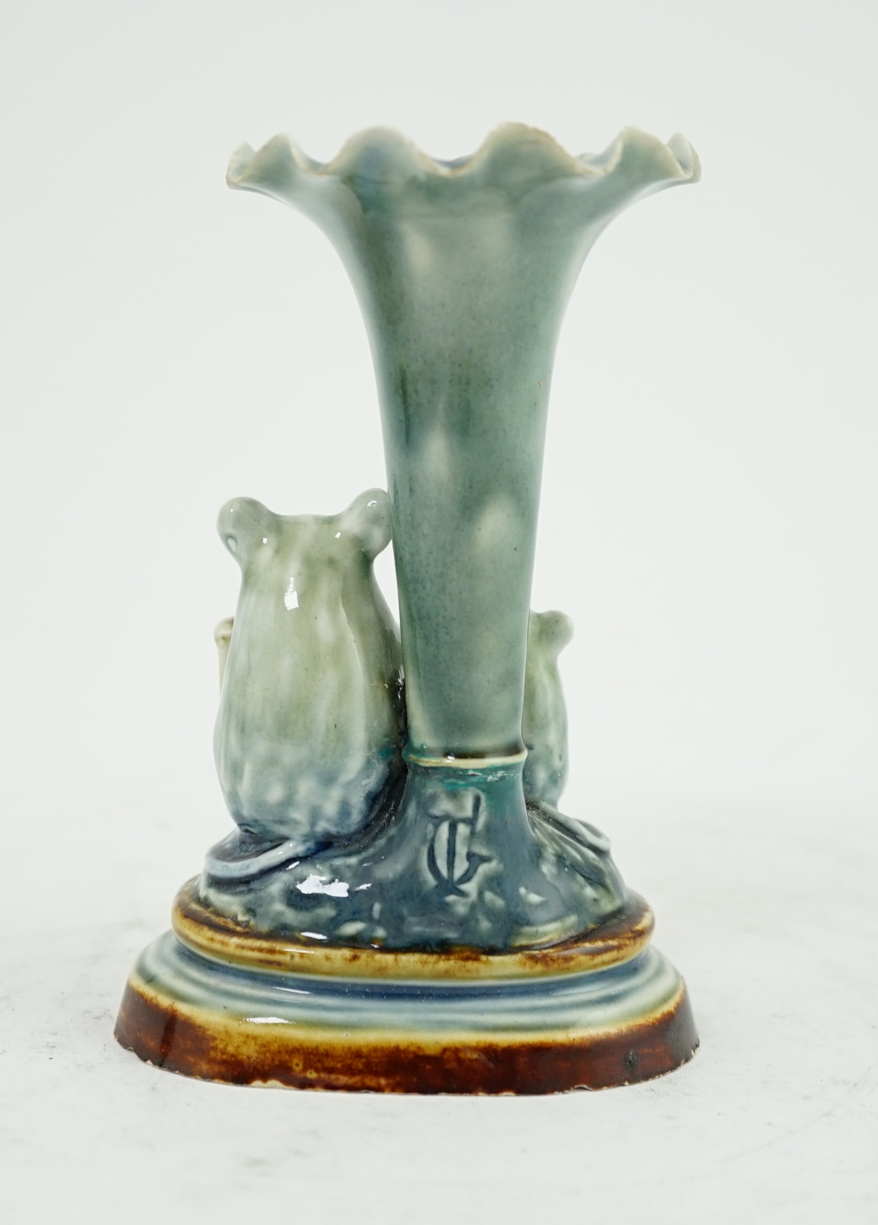 George Tinworth for Doulton Lambeth, an ‘organ grinder’ spill vase, c.1890